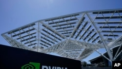 FILE - A Nvidia Corp. sign is displayed May 31, 2023, in Santa Clara, California, where it is headquartered. The chipmaker became the world's most valuable company on Tuesday.