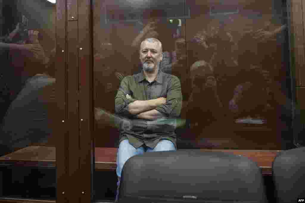 Igor Girkin (Strelkov), the former top military commander of the self-proclaimed Donetsk People&#39;s Republic and nationalist blogger, detained earlier Friday and accused of extremism, sits inside a glass defendants&#39; cage during a hearing to consider a request on his pre-trial arrest in Moscow.