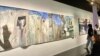 Many paintings at the Palestine exhibit depict barriers and barbed wire. The exhibit "What Palestine Brings to the World" at the Arab World Institute in Paris, runs through Nov. 19, 2023. (Lisa Bryant/VOA)