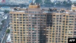 南京高楼火警酿15死 再掀电动自行车安全隐患