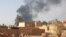 This picture taken in Aljazeera Eslang, north of Khartoum, shows smoke billowing in Omdurman, the capital's twin city, Sudan, July 3, 2023. 