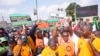 Labor union members march to protest economic hardship, in Lagos, Nigeria, Feb. 27, 2024. Nigerian workers began a new nationwide strike that threatens to shut down key services across the country.