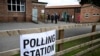 Voters arrive to a polling station at the Scout & Guide headquarters in Sowerby, north of England, July 4, 2024 as Britain holds a general election. Polls are predicting that Labour will win its first general election since 2005.