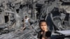 A girl looks on as she stands by the rubble outside a building that was hit by Israeli bombardment in Rafah in the southern Gaza Strip on Oct. 31, 2023.