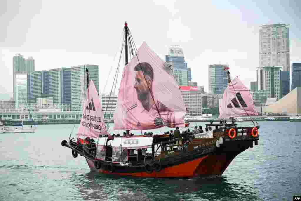 A junk with the face of Inter Miami CF Argentine forward Lionel Messi on its sail sails across Hong Kongs Victoria Harbor.