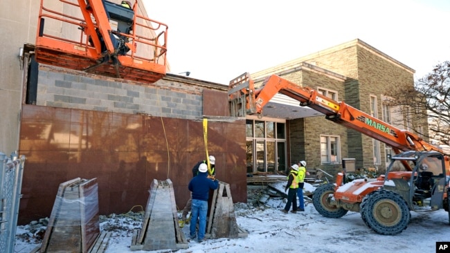 Workers begin demolition Wednesday, Jan. 17, 2023, at the Tree of Life building in Pittsburgh, the site of the deadliest antisemitic attack in U.S. history. (AP Photo/Gene J. Puskar, File)