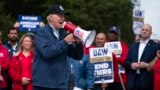 President Joe Biden speaks to striking United Auto Workers on the picket line outside the Willow Run Redistribution Center, UAW Local 174, Sept. 26, 2023, in Van Buren Township, Mich.