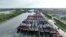 This photo taken on July 26, 2023, shows fishing boats moored at a port in preparation for approaching Typhoon Doksuri in Lianyungang, in China's eastern Jiangsu province. 