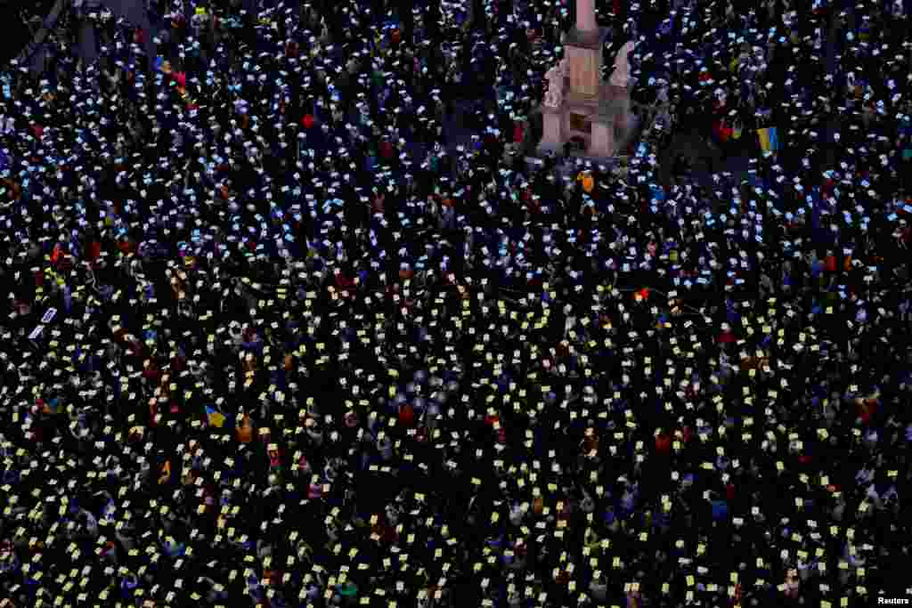 People attend a protest to mark the two-year anniversary of the Russian invasion of Ukraine, at the Old Town Square in Prague, Czech Republic, Feb. 24, 2024. 