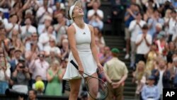 Ukraine's Elina Svitolina celebrates after beating Poland's Iga Swiatek to win their women's singles match at the Wimbledon tennis championships near London, July 11, 2023.