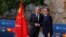 Spain's Foreign Minister Jose Manuel Albares, right, and China's Foreign Minister Wang Yi shake hands after a press conference following their meeting at Cordoba's Alcazar fortress, Spain, Feb. 18, 2024.