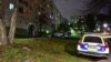 FILE - Police vehicles are parked outside an apartment block in Stockholm, Sweden, Nov. 14, 2021. An unnamed Chinese journalist reportedly was arrested in Stockholm last October and expelled last week after she was deemed a national security threat.