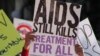 FILE - A man holds a placard as hundreds of AIDS activists march through the streets of Durban, South Africa during the 21st International Aids Conference on July 18, 2016. 