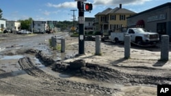 Mud and debris covers roads in Barre, Vermont, on July 11, 2024, after the remnants of Hurricane Beryl caused flooding. 