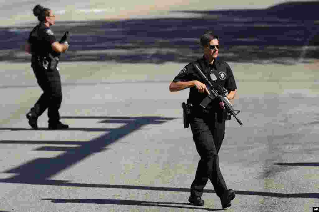 Law enforcement officers stand guard as the search for escaped convict Danelo Cavalcante continues in Pottstown, Pennsylvania.