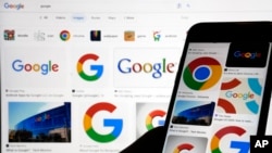 Various Google logos are seen in search results on two devices in New York, Sept. 11, 2023.