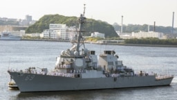 FILE - This US Navy photo shows the The Arleigh Burke-class guided-missile destroyer USS Milius (DDG 69) as it arrives at US Fleet Activities (FLEACT) Yokosuka on May 22, 2018 in Japan.