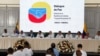 FILE - Representatives of Colombia's government and the Segunda Marquetalia armed group are seen during a press conference after the start of peace talks, in Caracas, Venezuela, June 24, 2024. 