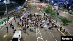 People attend a demonstration to demand the liberation of hostages who are being held in the Gaza Strip after they were seized by Hamas gunmen on Oct. 7, in Tel Aviv, Israel, Nov. 21, 2023.