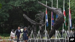 Dutch King Willem-Alexander and Queen Maxima lay a wreath at the slavery monument at an event commemorating the abolition anniversary in Amsterdam, Netherlands, July 1, 2023.