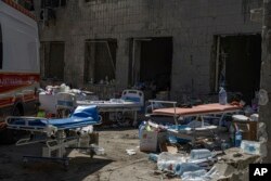 Gurneys are seen outside the Okhmatdyt children's hospital after it was hit by Russian missiles, in Kyiv, Ukraine, July 9, 2024.