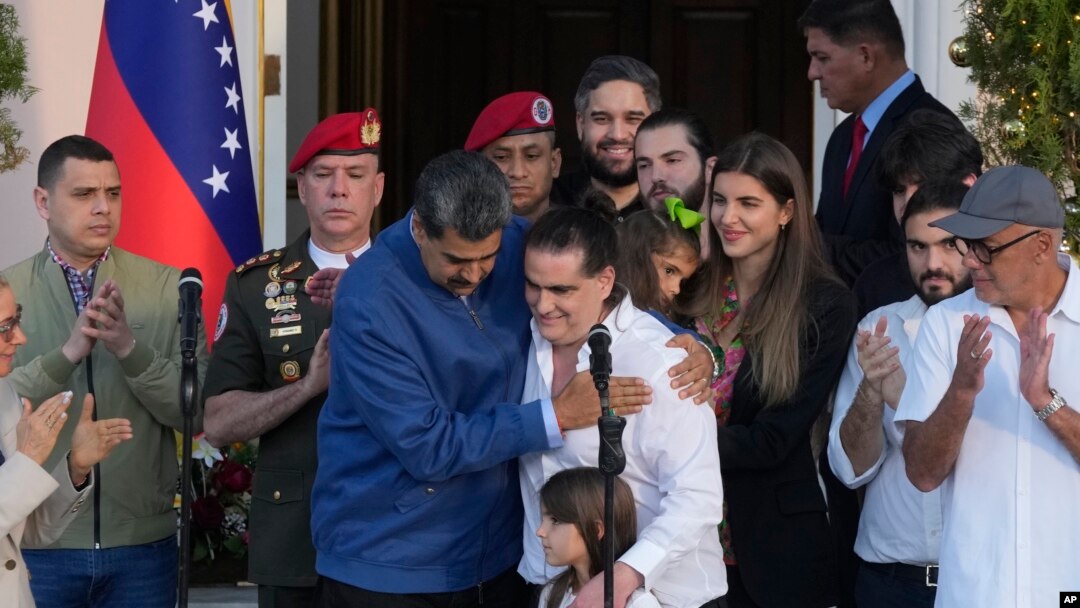 Venezuelan President Maduro, center left, embraces Alex Saab after Saab arrived at Miraflores presidential palace in Caracas, Venezuela, Dec. 20, 2023.