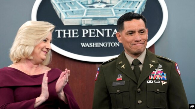 Army Secretary Christine Wormuth applauds after giving the Army Astronaut Device to Col. Frank Rubio at a ceremony at the Pentagon in Washington, Feb. 22, 2024. Rubio holds the U.S. record for the most days in space for a single spaceflight - 371.