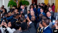 FILE - President Joe Biden greets members of the audience during a reception in recognition of Black History Month in the East Room of the White House in Washington, Feb. 6, 2024. 