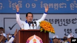 FILE - Cambodia Prime Minister Hun Sen, center, also president of Cambodian People's Party, delivers a speech during his party election campaign in Phnom Penh, Cambodia, July 1, 2023.