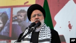 FILE - Iranian President Ebrahim Raisi speaks during an anti-Israel rally at Islamic Revolution Square in Tehran, Iran, Oct. 18, 2023.