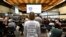 A member of the United Organisation of Victims stands in a Brussels courtroom prior to the reading of sentences during the trial regarding the attacks at a metro station and airport, Sept. 15, 2023. (John Thys, Pool Photo via AP)