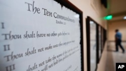 FILE - The Ten Commandments are posted with other documents in the Georgia Capitol, June 20, 2024, in Atlanta. Civil liberties groups sued June 24, challenging Louisiana’s requirement that the Ten Commandments be displayed in public school classrooms.