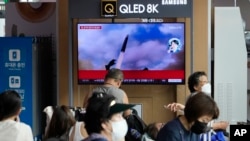 A TV screen shows an image of North Korea's missile launch during a news program at the Seoul Railway Station in Seoul, South Korea, July 12, 2023. 