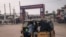 A "tuk-tuk" cab passes the entrance to one of the facilities of the 9th Jeux de la Francophonie in Kinshasa, Democratic Republic of Congo, on July 25, 2023. 