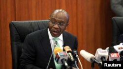 FILE — Nigeria's former Central Bank Governor Godwin Emefiele speaks during the monthly Monetary Policy Committee meeting in Abuja, Nigeria May 22, 2018. 