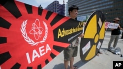 Environmental activists protest the Japanese government's decision to release treated radioactive water from Fukushima nuclear power plant, in Seoul, South Korea, July 6, 2023.