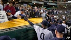 New York Yankees' Domingo German (0) acknowledges fans while leaving the field after he pitched a perfect game against the Oakland Athletics in a baseball game in Oakland, California, June 28, 2023. The Yankees won 11-0.