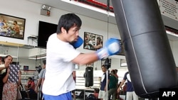 FILE - Philippine boxing icon Manny Pacquaio trains at a gym in General Santos City in southern island of Mindanao, Feb. 21, 2015. 
