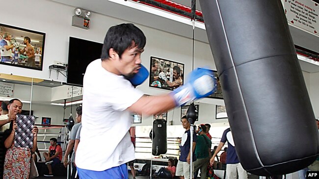 FILE - Philippine boxing icon Manny Pacquaio trains at a gym in General Santos City in southern island of Mindanao, Feb. 21, 2015.