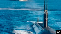 ແຟ້ມຮູບ-ໃນພາບທີ່ສະໜອງໃຫ້ໂດຍກະຊວງປ້ອງກັນປະເທດເກົາຫຼີໃຕ້ນີ້ ສະແດງໃຫ້ເຫັນກໍາປັ່ນບັນທຸກເຮືອບິນ USS Ronald Reagan ແລະກໍາປັ່ນ USS Annapolis ປະຕິບັດການຊ້ອມລົບຮ່ວມກັບເກົາຫຼີໃຕ້, ສະຫະລັດ ແລະຍີ່ປຸ່ນ ຢູ່ນອກຊາຍຝັ່ງທາງທິດຕາເວັນອອກຂອງເກົາຫຼີໃຕ້, ວັນທີ 30 ກັນຍາ 2022.