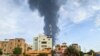 Smoke billows behind buildings amid ongoing fighting in Khartoum on June 9, 2023. 