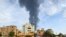Smoke billows behind buildings amid ongoing fighting in Khartoum on June 9, 2023. 
