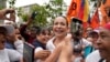 Supporters embrace opposition leader Maria Corina Machado during a rally in San Antonio, Venezuela, April 17, 2024. The Biden administration on Wednesday reimposed oil sanctions on Venezuela, admonishing Nicolas Maduro's efforts to consolidate his rule.