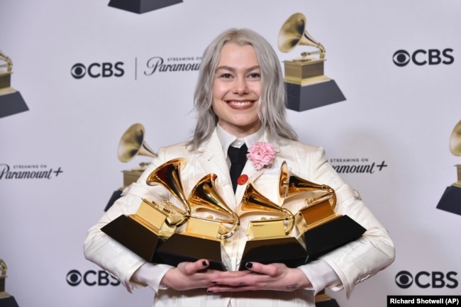 Phoebe Bridgers poses in the press room with awards during the 66th annual Grammy Awards on Sunday, Feb. 4, 2024, in Los Angeles. (Photo by Richard Shotwell/Invision/AP)