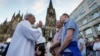 FILE - Same-sex couples take part in a public blessing ceremony in front of the Cologne Cathedral in Cologne, Germany, on Sept. 20, 2023. The Vatican said Dec. 18, 2023, in a ruling approved by Pope Francis that Catholic priests can administer blessings to same-sex couples.