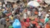 Pedestrians shop for pepper and other food items at the Mile 12 Market in Lagos, Nigeria, Feb. 16, 2024. Nigerians are facing one of the West African nation's worst economic crises in many years.