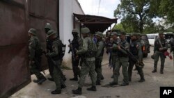 FILE - Soldiers raid the Tocorón Penitentiary Center, in Tocorón, Venezuela, Sept. 20, 2023. 