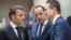 France's President Emmanuel Macron, left, speaks with Cypriot President Nikos Christodoulides, second right, and Slovakia's Prime Minister Ludovit Odor during a round table meeting at an EU summit in Brussels, June 29, 2023.