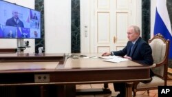 Russian President Vladimir Putin chairs a meeting on the social and economic development of Crimea and Sevastopol via a videoconference at the Moscow's Kremlin in Moscow, March 17, 2023. (Mikhail Metzel, Sputnik, Kremlin Pool Photo via AP)
