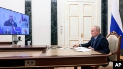 Russian President Vladimir Putin chairs a meeting on the social and economic development of Crimea and Sevastopol via a videoconference at the Moscow's Kremlin in Moscow, March 17, 2023. (Mikhail Metzel, Sputnik, Kremlin Pool Photo via AP)